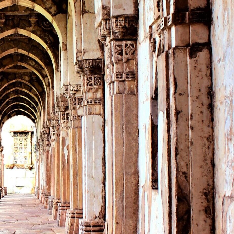 A stunning view of ancient stone arches in a historic Indian architectural landmark.
